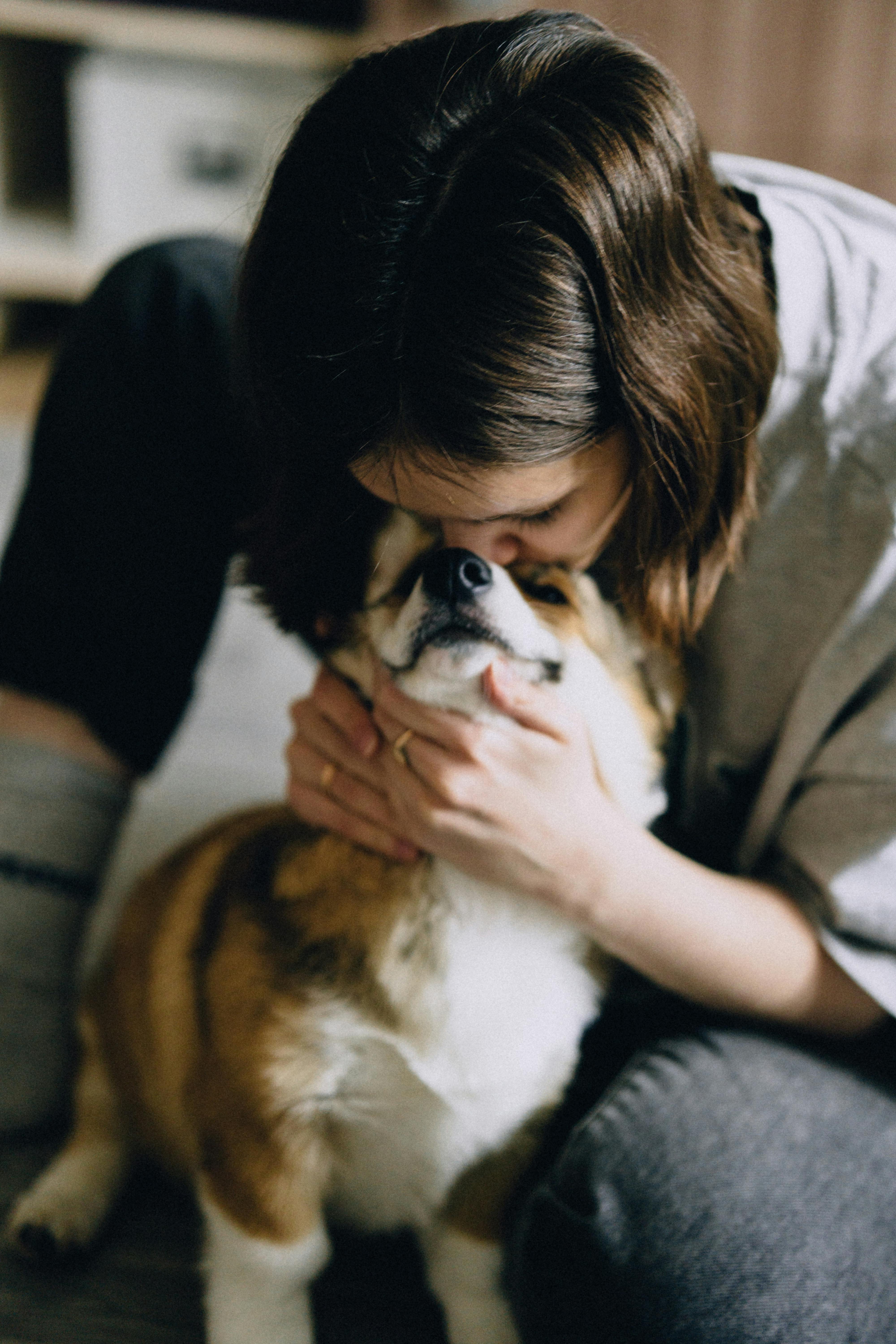 Woman bonding with her dog | Source: Midjourney